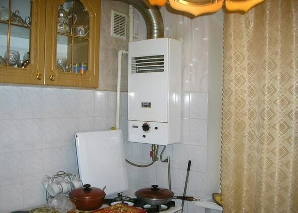Wall mounted gas boiler in the kitchen in the apartment 
