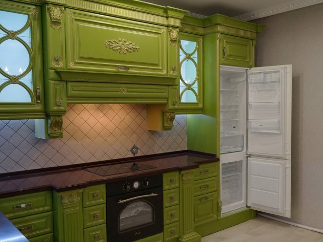 Luxurious kitchen in bright green. Timeless classics