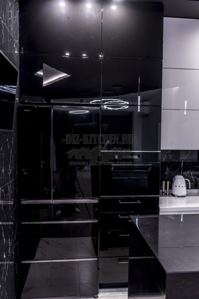 Black refrigerator with glossy interior