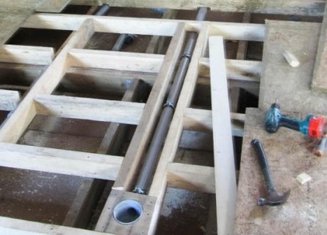 Floor installation in a bathhouse on screw piles