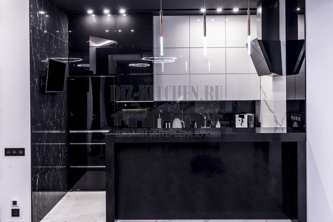 Black and white glossy kitchen with black bar counter