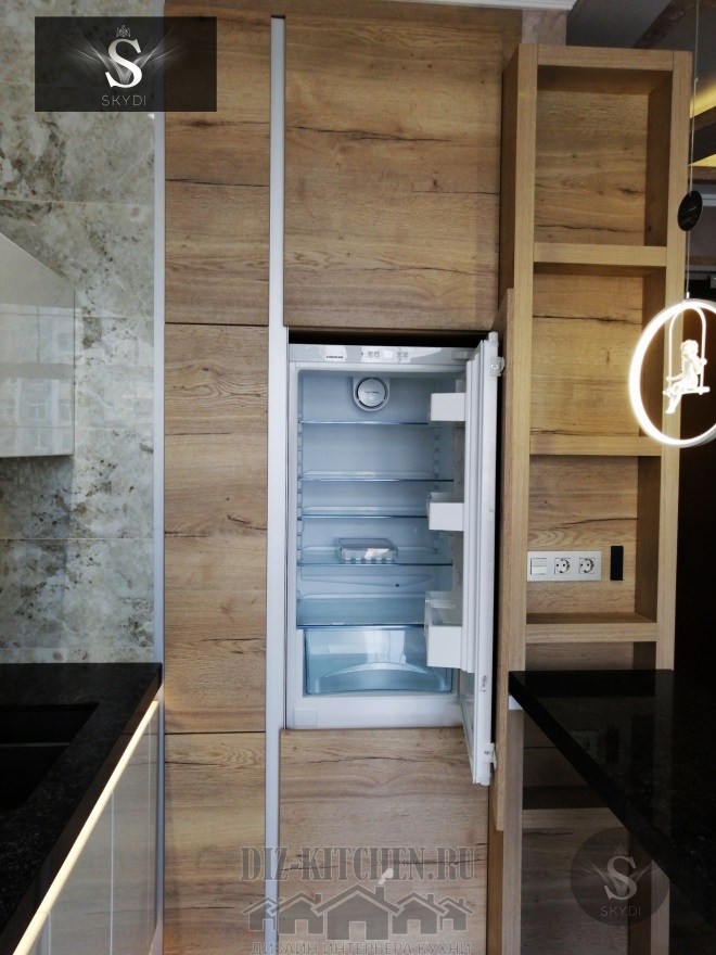 Modern wall-mounted kitchen in the studio with a wall cabinet